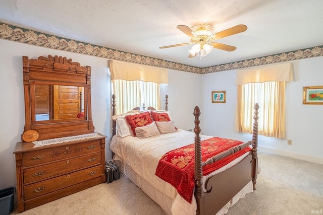 bedroom featuring ceiling fan and light colored carpet