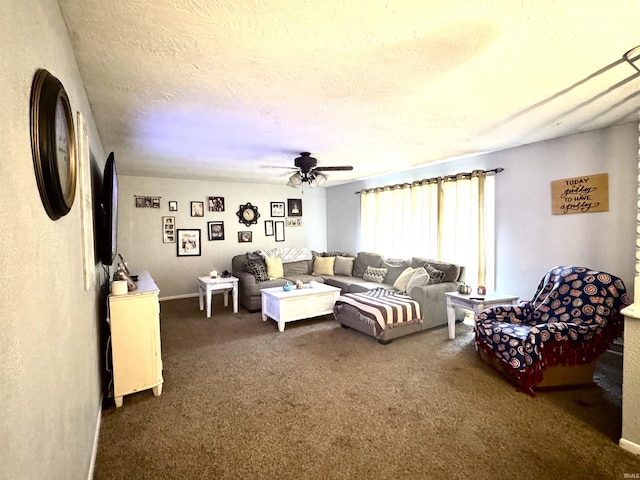 living room featuring dark colored carpet, ceiling fan, and a textured ceiling