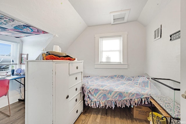 bedroom with light hardwood / wood-style flooring and vaulted ceiling