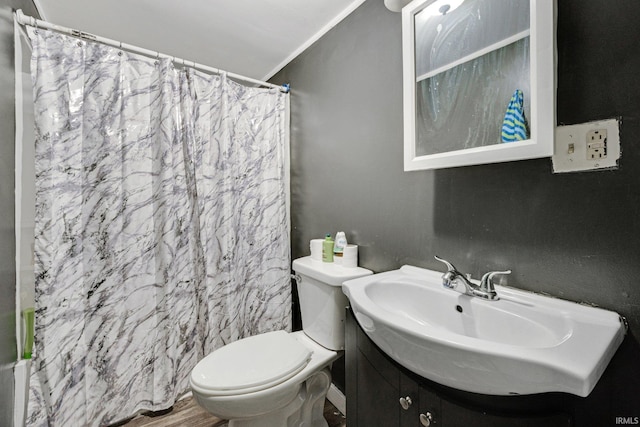 bathroom featuring walk in shower, ornamental molding, toilet, vanity, and hardwood / wood-style flooring