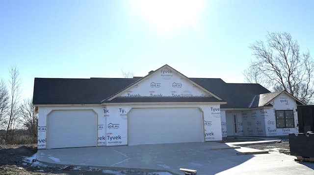 unfinished property with a garage