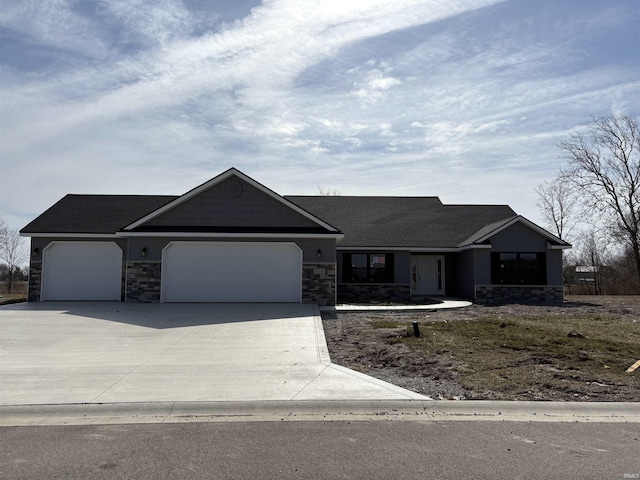 ranch-style home with an attached garage, stone siding, and concrete driveway