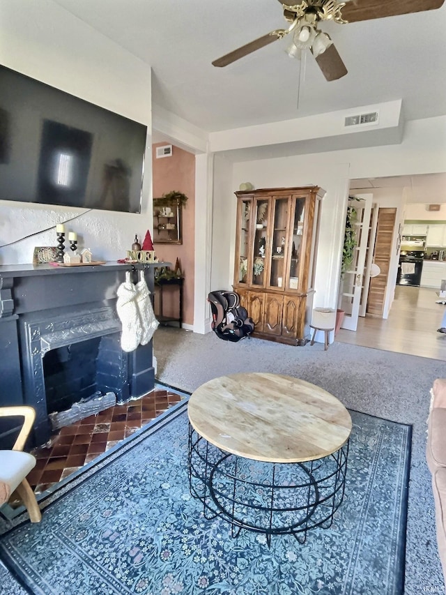 living room featuring ceiling fan