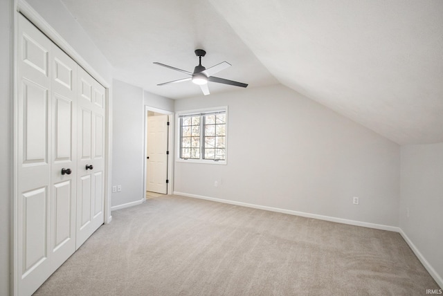 bonus room featuring ceiling fan, light colored carpet, and lofted ceiling