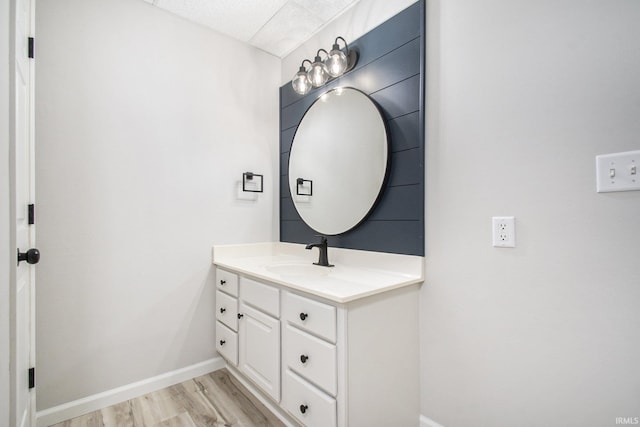 bathroom with hardwood / wood-style flooring and vanity