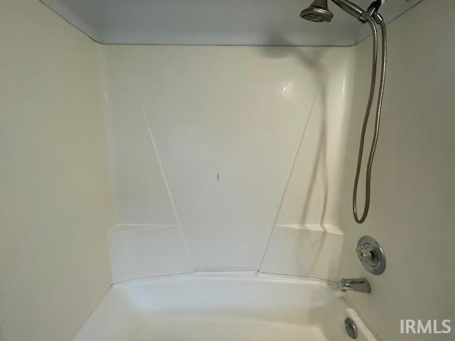 bathroom featuring washtub / shower combination