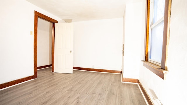 spare room with light hardwood / wood-style flooring