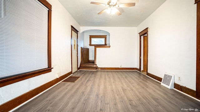 unfurnished room with ceiling fan and dark hardwood / wood-style floors