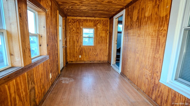 unfurnished sunroom with wood ceiling