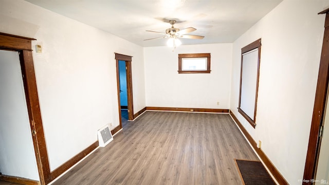 spare room featuring ceiling fan and wood-type flooring