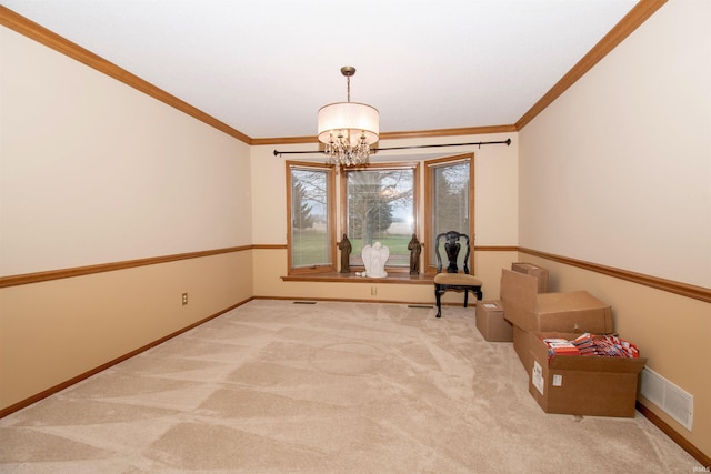 unfurnished room featuring light carpet, ornamental molding, and a notable chandelier