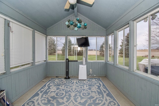 sunroom / solarium featuring vaulted ceiling, a wealth of natural light, and ceiling fan