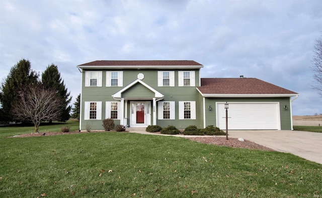 colonial house with a garage and a front lawn