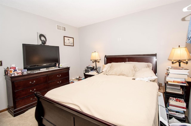 bedroom featuring light colored carpet