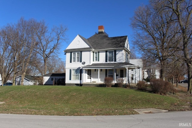 view of front of property featuring covered porch and a front yard