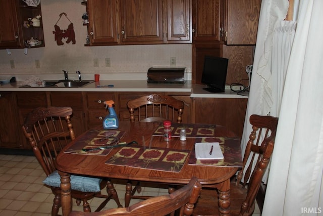 kitchen featuring sink and light tile patterned floors