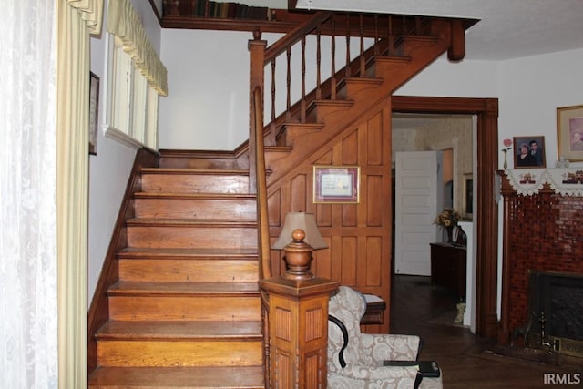 stairway featuring hardwood / wood-style flooring