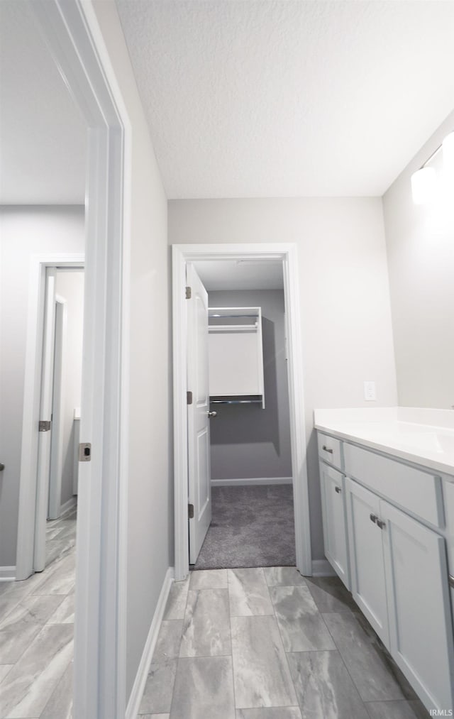 bathroom featuring vanity and a textured ceiling