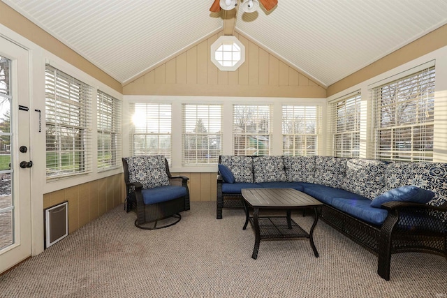 sunroom / solarium with ceiling fan and vaulted ceiling