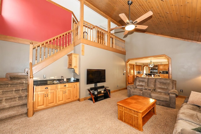 carpeted living room with high vaulted ceiling, ceiling fan, and wooden ceiling