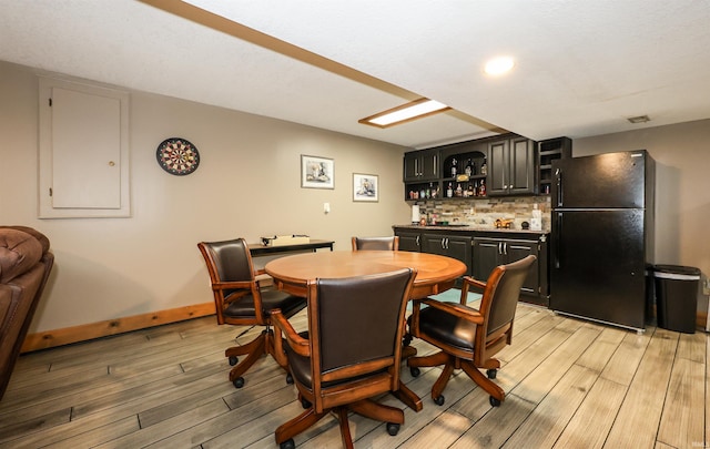 dining room with light wood-type flooring