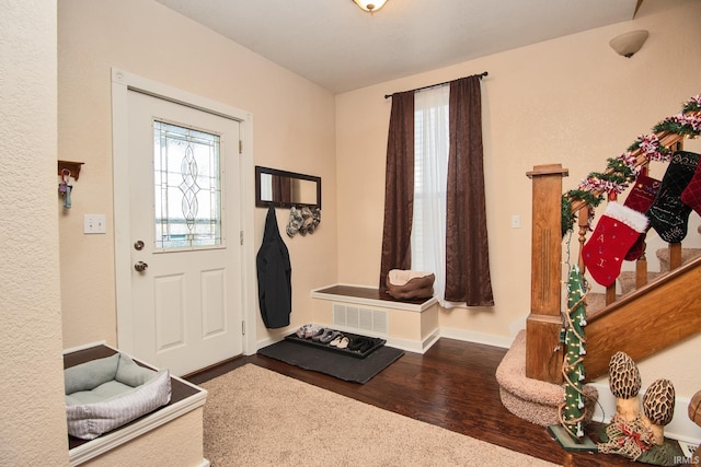 foyer entrance featuring hardwood / wood-style floors