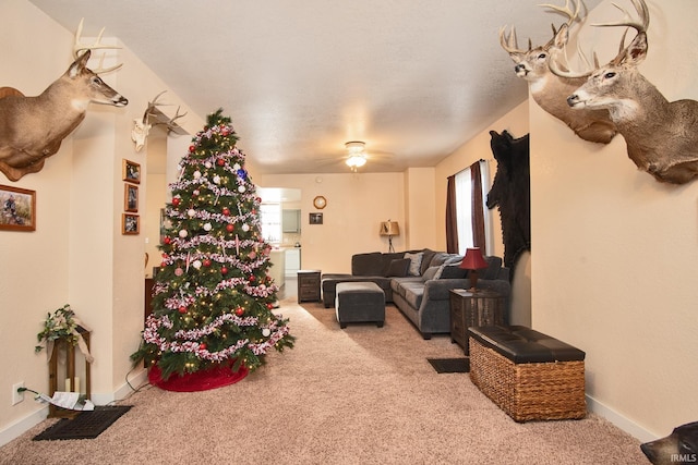 living room with light carpet and ceiling fan