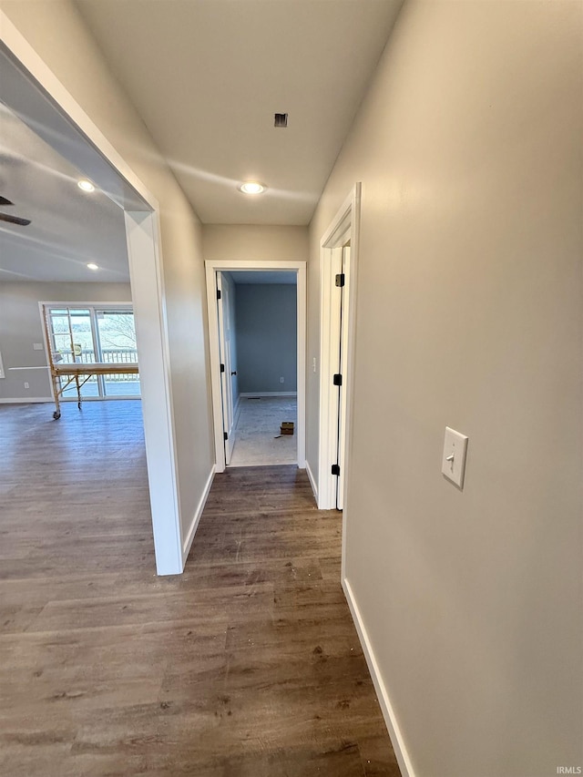 hallway featuring dark hardwood / wood-style floors