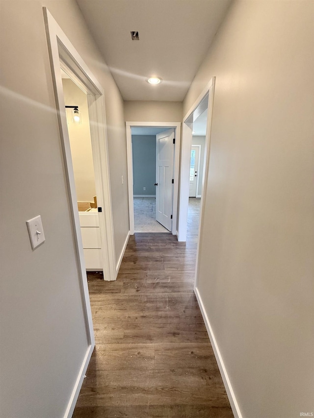 hall featuring dark wood-type flooring