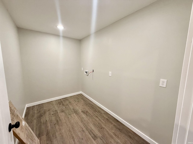 clothes washing area featuring hardwood / wood-style flooring