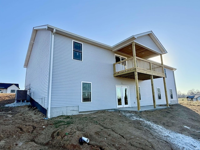 rear view of house with a balcony