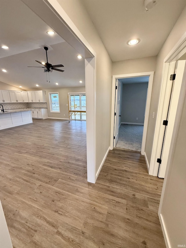 hall with hardwood / wood-style floors