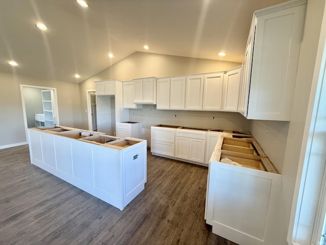 kitchen featuring white cabinetry, hardwood / wood-style floors, and a center island