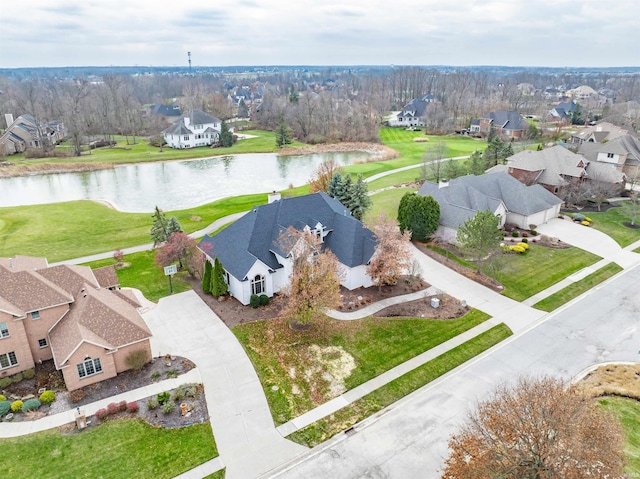 birds eye view of property with a water view