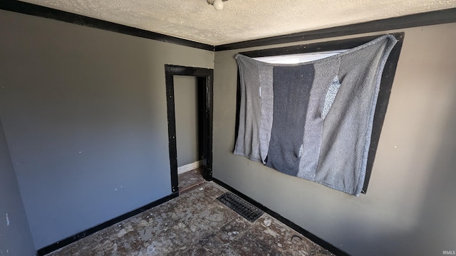 interior space with a textured ceiling