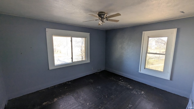 spare room with ceiling fan