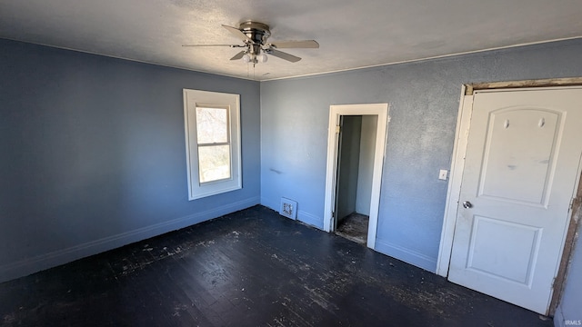 unfurnished bedroom featuring ceiling fan