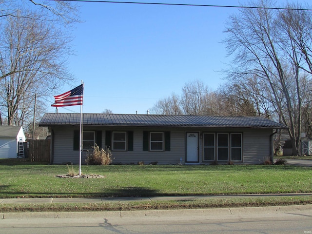 ranch-style home with a front lawn