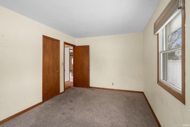 unfurnished room with light colored carpet