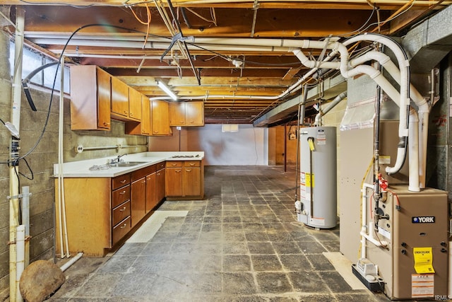 basement featuring heating unit, sink, and gas water heater