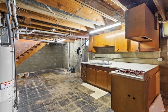 basement featuring water heater and sink