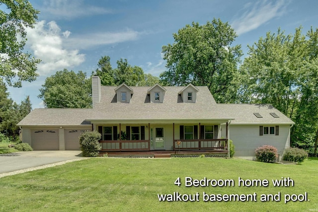 new england style home with a garage, covered porch, and a front yard