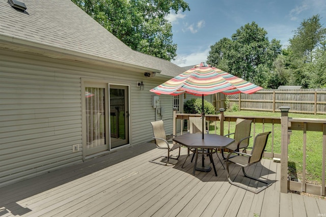 deck featuring a lawn