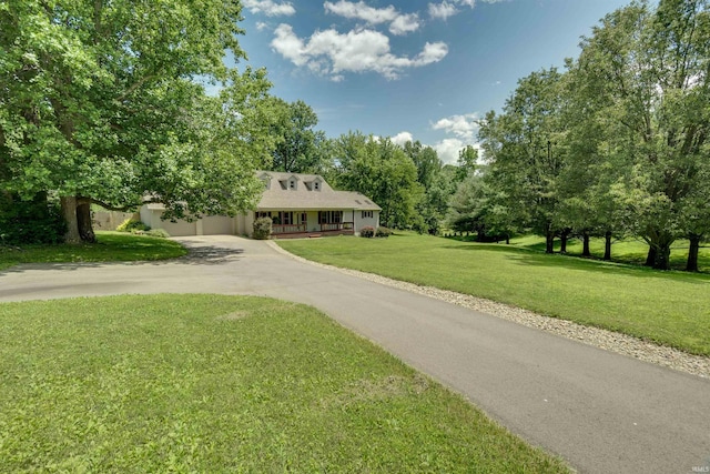 view of front of property with covered porch and a front yard