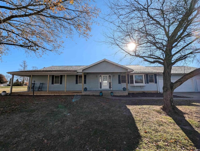 ranch-style home with a porch and a front lawn