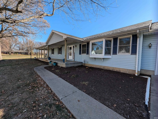 ranch-style house featuring a porch