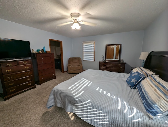 bedroom with light carpet, ceiling fan, and a textured ceiling