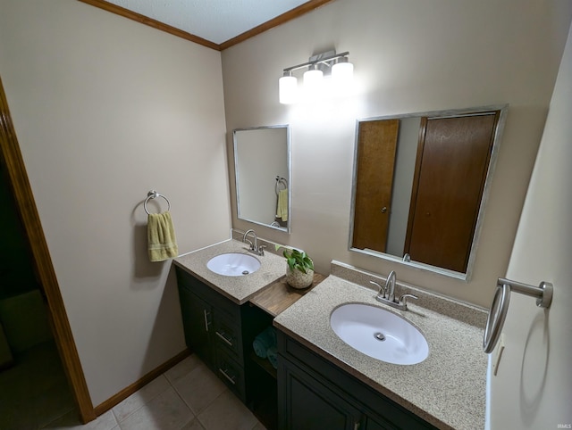 bathroom with tile patterned flooring, vanity, and ornamental molding