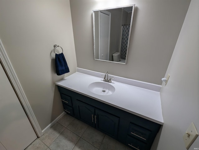 bathroom with tile patterned flooring and vanity