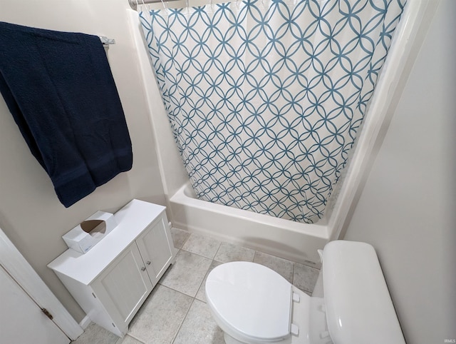 bathroom featuring tile patterned flooring, shower / bath combination with curtain, and toilet